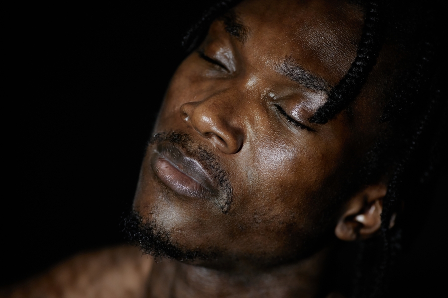 Listening to the Inner Teacher Young man with eyes closed meditating